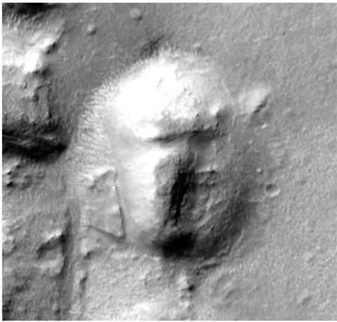 Figure 26: MRO orbiter image of the face from CTX:P04_002714_2144_XI_34N212W of Galaxies at different lighting. Note the right lower part of the face-shaped object has apparently collapsed, due a mass wasting event, to a lower level than the rest of the object.