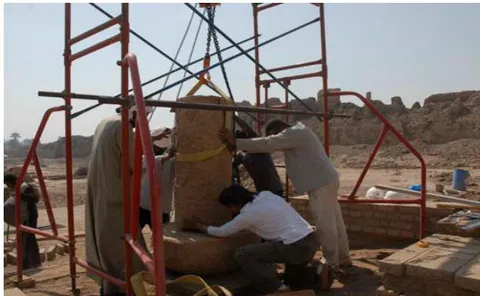 Figure 40: Senior conservator Lotfi, the Author & assistants replace the shaft part of the column on original base of the southern side.