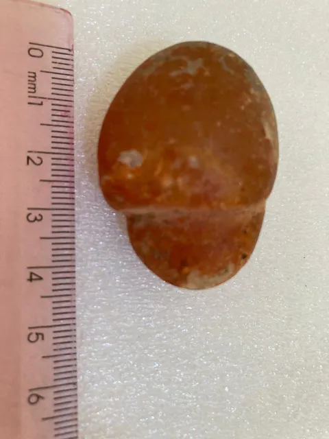Material lítico. Comprimento: 5cm. Largura: 3cm. Espessura: 2cm. Peso: 64g.