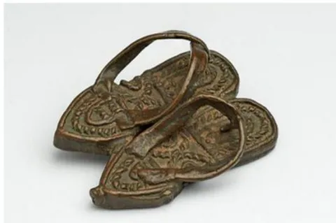 Figure 9: Akan gold-weight, Tortoise "Akyekyede3". Image size: 500 \times 304 Figure 11: Akan Gold Weight, Traditional sandals Image size: 544 × 350 mostly in museums and private collections (Payne, 2015). The gold-weights are also collected to tell their respective philosophical connotations assigned to their designs. As teaching aids in exhibition spaces, they are mounted in cultural-based institutions to tell the lives of the past generations of the Akans.