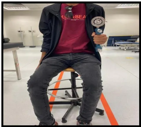 Figure 3: Measurement of grip strength by using (handheld dynamometer). Frontal view