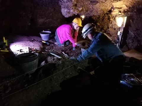 Fig. 2. Excavation in progress within the Ravne 3 tunnel, Chamber R3-1 — the elevated floor zone that produced most of the metal and ceramic finds described in this paper (photo: Amna Agić; in Osmanagich, Hoyle, Agić & Delibašić, 2023; republished in Osmanagich, 2025).