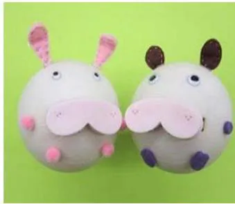 Fig. 3: Left: first version of Kissenger was a head-shaped device with a realistic pair of lips. Right: second version of Kissenger was designed to look like a cute animal character with soft silicone lips.