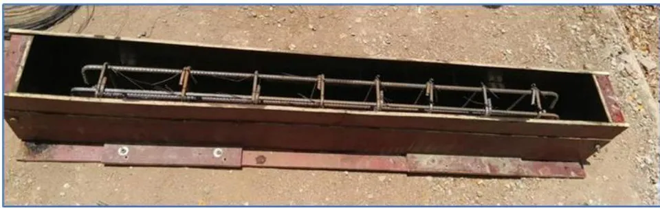 Fig. 3: Laying Reinforcement into wooden mould