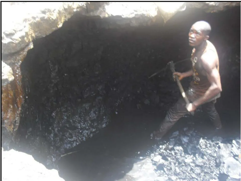 Fig. 1: An Artisanal Miner using a digger to excavate a Coal Seam