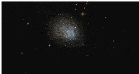 Fig. 6: Galaxy NGC3741: Speckling of stars extending to the upper left and lower right of this galaxy are seen faintly (not clearly in this print). It is tempting to call them spiral arms or attempting at spiral arms. (Hubble Space Telescope image, Wikipedia "NGC 3741")